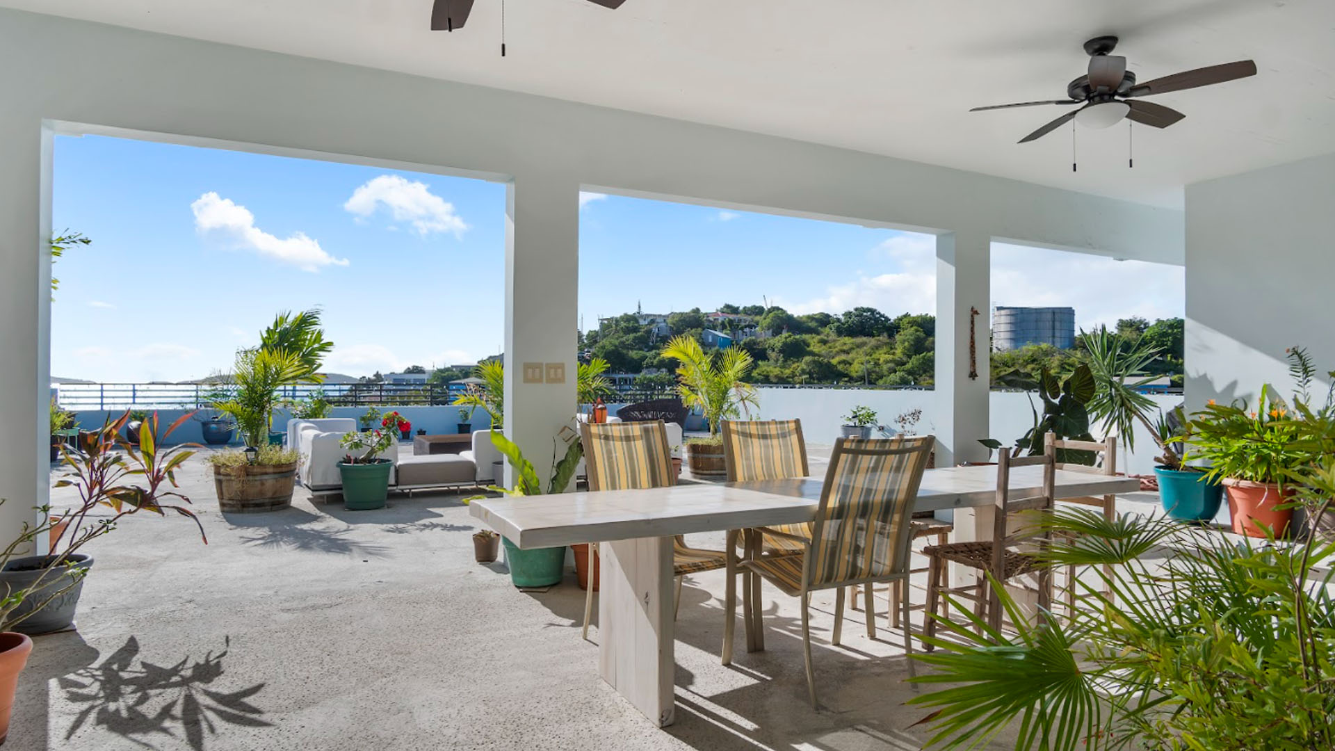 Rooftop dining terrace with harbor view